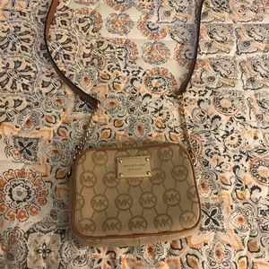 Michael Kors crossbody purse. Falls just below my hip.